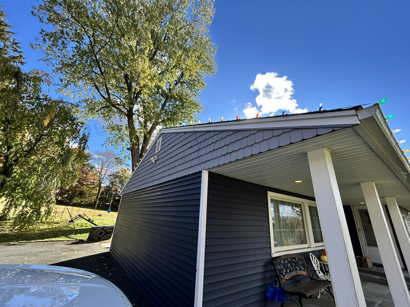 Suburban home in daylight before permanent lighting